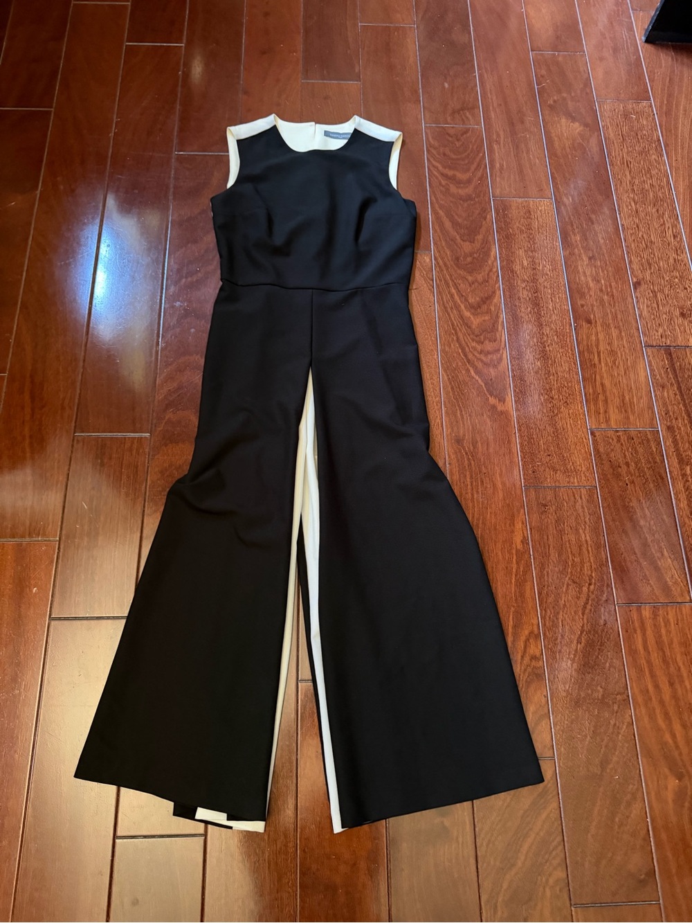 Sleeveless Black Jumpsuit with Cream Trim and Wide Split Legs